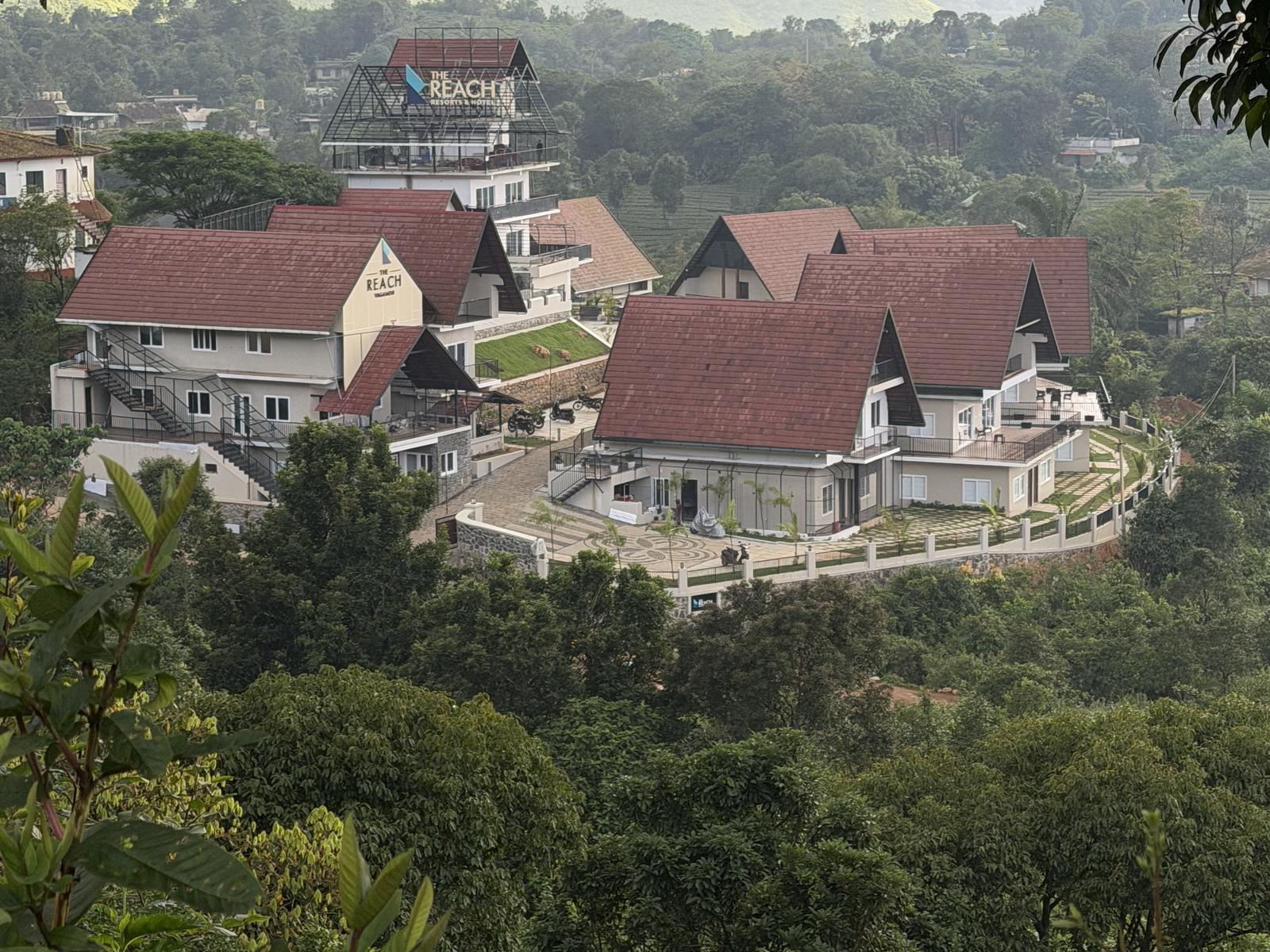 The Reach Vagamon — the A-frames and the main block seen from the hills opposite